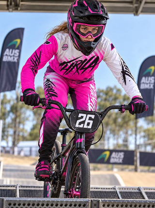 THRILA Vulcan Pink BMX racewear on a rider