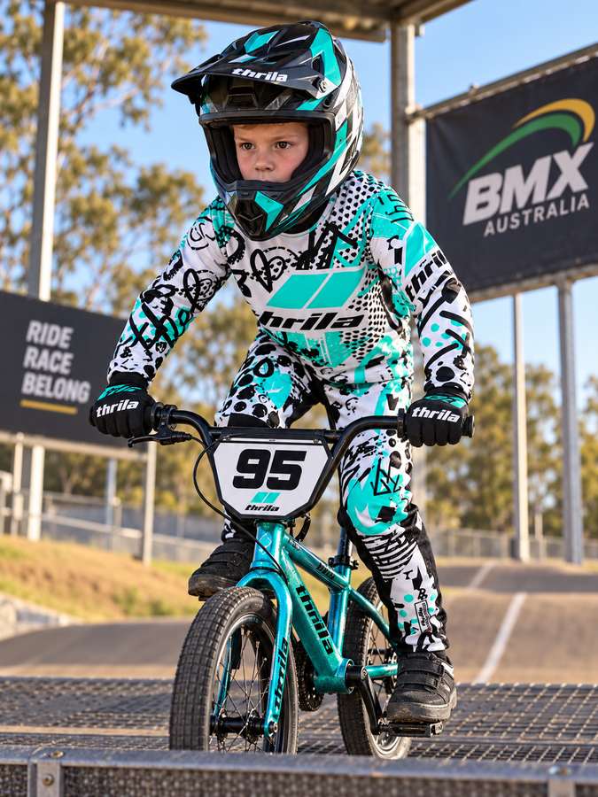 THRILA Graf Teal BMX racewear on a rider