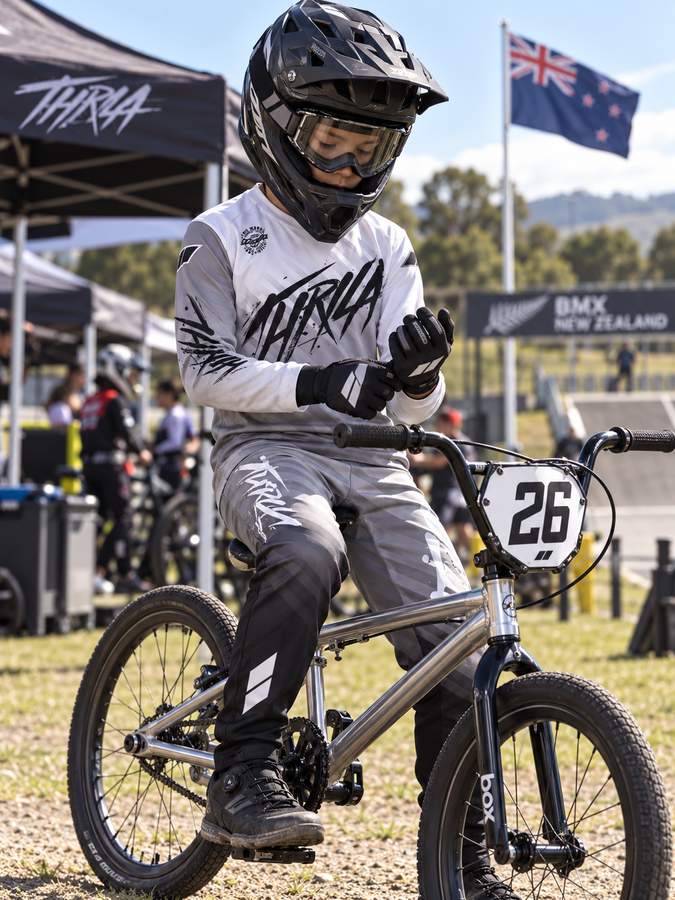 THRILA Vulcan Grey BMX racewear on a rider